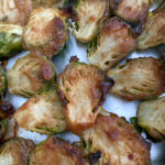 These crispy Brussel Sprouts are made with a homemade glaze featuring medjool dates, dijon mustard, and olive oil. They are both soft and crunchy on the inside with a crispy outer edge.