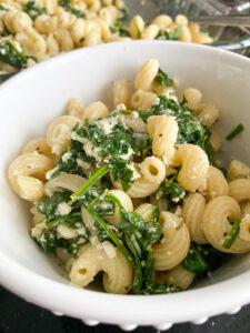 This Baked Spinach and Feta Pasta is a warm and creamy take on classic Greek Spanakopita. It's made with fresh baby spinach, a block of feta cheese, and many other delicious flavors!