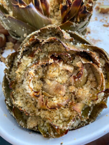 Artichokes are super healthy so they can be a great addition or star of any dinner! This recipe fills the hearty artichokes with a delicious blend of flavors and spices. They're stuffed with breadcrumbs, onions, garlic, parmesan cheese and more!