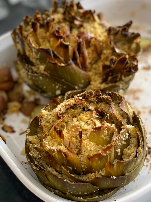 Artichokes are super healthy so they can be a great addition or star of any dinner! This recipe fills the hearty artichokes with a delicious blend of flavors and spices. They're stuffed with breadcrumbs, onions, garlic, parmesan cheese and more!