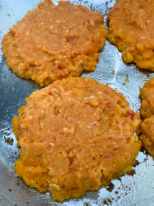 Chickpea Veggie Burgers are a great way to use up so many veggies in your fridge and make a delicious dinner that is packed with nutrients. This recipe features 5 different vegetables plus chickpeas; they are vegetarian and can be made vegan!